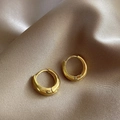 Polished gold geometric round hoop earrings displayed on elegant champagne silk fabric - E6013 Gold Polished Hoops