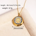 Detail view of a gold sun face pendant necklace with dimensions 40+5cm and 6.7g weight - Sun