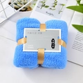 Sky blue coral fleece face towel tied with gold ribbon in a premium gift packaging - Lake Blue