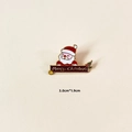 Detail showing a 3.0cm Santa Claus brooch with Merry Christmas text on cream leather - Santa Holding Sign