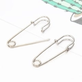 Minimalist silver paperclip earrings in a pair, featuring a sleek metallic polished finish - White K Pin Earrings 1 Pair (5636)