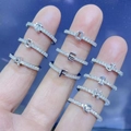 Silver alphabet letter rings with cubic zirconia stones worn on female fingers - Letter A / Silver