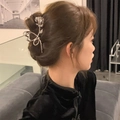 Detailed view of a silver metal rose hair claw clip worn in a Y2K hairstyle - Silver Rose Flower Shape (FJ0285)