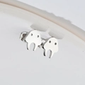 Polished stainless steel monster-shaped stud earrings in a minimalist silver finish - Ghost / Steel