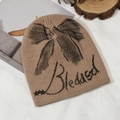 Camel knit beanie with black bow and Blessed text design for autumn and winter style - Khaki