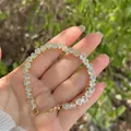 Elegant 18K gold plated heart tennis bracelet with cubic zirconia on female wrist - Heart Pavé Zirconia