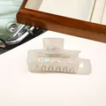 Close-up of a pearlescent white rectangular hair claw clip with iridescent finish detail - PVC 7.5cm Rectangular - Iridescent Grey
