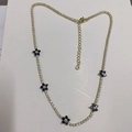 Detail of gold choker with blue zircon flowers and sparkling claw chain link - Sapphire Blue