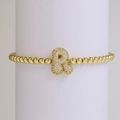Elastic beaded 18k gold plated bracelet featuring a sparkling zircon letter R charm - Letter R