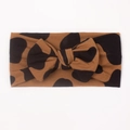 Detail view of baby bow headband with brown and black leopard-style polka dot pattern - Style C (Large Spot Leopard)