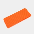 Detail of bright orange knitted headband with a textured ribbed pattern for winter wear - M / Orange