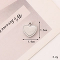 Macro shot of a silver heart-shaped zinc alloy charm with bead edge and 1.5cm x 1.4cm dimensions - C341 14mm*15mm Silver Smooth Heart