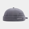 Detailed close-up of dark grey canvas docker cap with white Russian hip-hop embroidery - Adjustable / Fog Blue