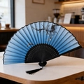 Chinese style folding fan with blue gradient plum blossom pattern and black tassel detail - Style 50 (New Style)