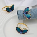 Macro view of gold butterfly napkin ring with purple enamel inlay and blue rhinestones - Z1216-BLU Blue Purple Gradient Butterfly