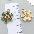 Green and gold snowflake enamel pendant with red rhinestone and reverse view detail - Green Snowflake 16x21mm