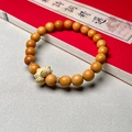 Zen style sandalwood bracelet featuring round wooden beads and a lotus flower pendant - Sandalwood 8mm with Lotus Pendant