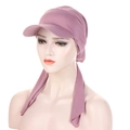 Detailed view of lavender knit turban hat with stylish sun visor and decorative bow ties - Leather Purple
