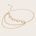 Detail of layered gold metal waist chain with hollow moon and star charms on beige base - Moon Double Layered Chain (Gold)