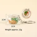 Porte-clés mini aquarium carpe koi avec poisson rouge dans une sphère résine 3cm - Style porte-clés / Tête rouge corps d'argent