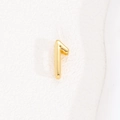 Macro shot of gold-plated number 1 earring charm with a high-polished metallic finish - Number 1