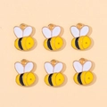 Detailed view of six cute honeybee enamel pendants with gold plating for jewelry making - Bee