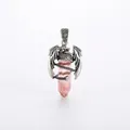 Pink hexagonal crystal pendant with silver dragon wrap on white background - Watermelon red