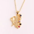 Golden butterfly necklace with colorful zircon stones and crystal accents on a pink background - Hollow Side Butterfly Style (XL198-1)