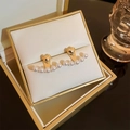 Macro detail of gold heart stud earrings with white pearls in a luxury jewelry box - Gold Heart Curved Pearl Style (56#)