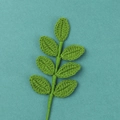Detailed macro view of a handmade green crochet stem with seven knitted leaves - (7 Leaves) Four-season Foliage And Flowering Branches - Dark Green