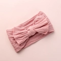 Detailed view of dusty pink jacquard knit baby headband featuring a soft large bow - Deep Pink