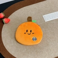 Detail of cute plush orange coin purse with happy embroidery and green leaf on wood tray - Tangerine Coin Purse