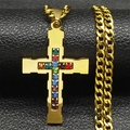 Detailed close-up of a gold cross pendant set with colorful stones on dark leather - Gold Style A-Cuban Chain