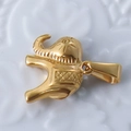 Macro detail of a 24k gold-plated elephant pendant with embossed metal textures - Elephant / Gold