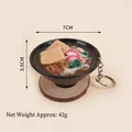 Miniature 7cm udon noodle bowl keychain with realistic toppings on a wooden base - Ham Dried Tofu Noodles Keychain