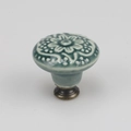 Gray ceramic furniture knob with white floral relief and antique bronze metal base - High Base / Green
