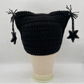 Handmade black cat ear beanie with stars and striped tassels on a white background - Black