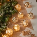 Warm white faceted LED crystal ball string lights on snowy pine branches for Xmas - 1.5m 10-LED Battery Powered / Plated Gold Ball
