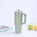 Close-up of 40oz stainless steel vacuum insulated tumbler with ergonomic handle and straw - Matcha Green (Generation 2)