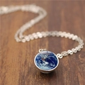 Macro shot of silver chain necklace with earth pattern glass dome pendant on wood background - 12mm / Silver
