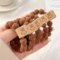 Elastic hair tie set featuring brown woven pom-pom beads and cute rabbit motifs - Plush With Rabbit Tag / Light Coffee Rabbit