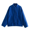 Detail of Klein blue cropped jacket with tweed texture, high collar and large pockets - Blue
