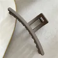 Matte coffee brown square hair claw clip for thick hair shown on a stone background - Barrette Dark Brown-13cm