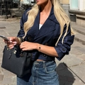 Navy blue satin double-breasted jacket with glossy finish worn by a model in a street setting - S / Navy Blue