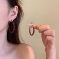 Close-up of retro large dark brown resin hoop earrings on model with a minimalist style - 35# 925 Sterling Silver Earring Post-Wine Red Retro Resin Hoop Earrings