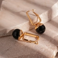 Detail of vintage geometric earrings with black beads and golden square frames on stone - Black Geometric Style (HE22454)