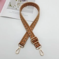 Close-up of geometric woven replacement shoulder strap with gold metal buckles - Khaki Orange Green + Gold Hook