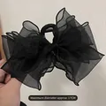 Detail of a 17cm large black mesh bow hair claw clip featuring tiered organza texture - Black Bow Claw Clip