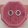 Silver circular earrings presented in a pink octagonal velvet jewelry box for display - Ring / Silver