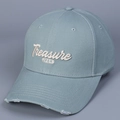 Detailed macro view of white 3D letter embroidery and vintage distressed cap brim - Light Blue